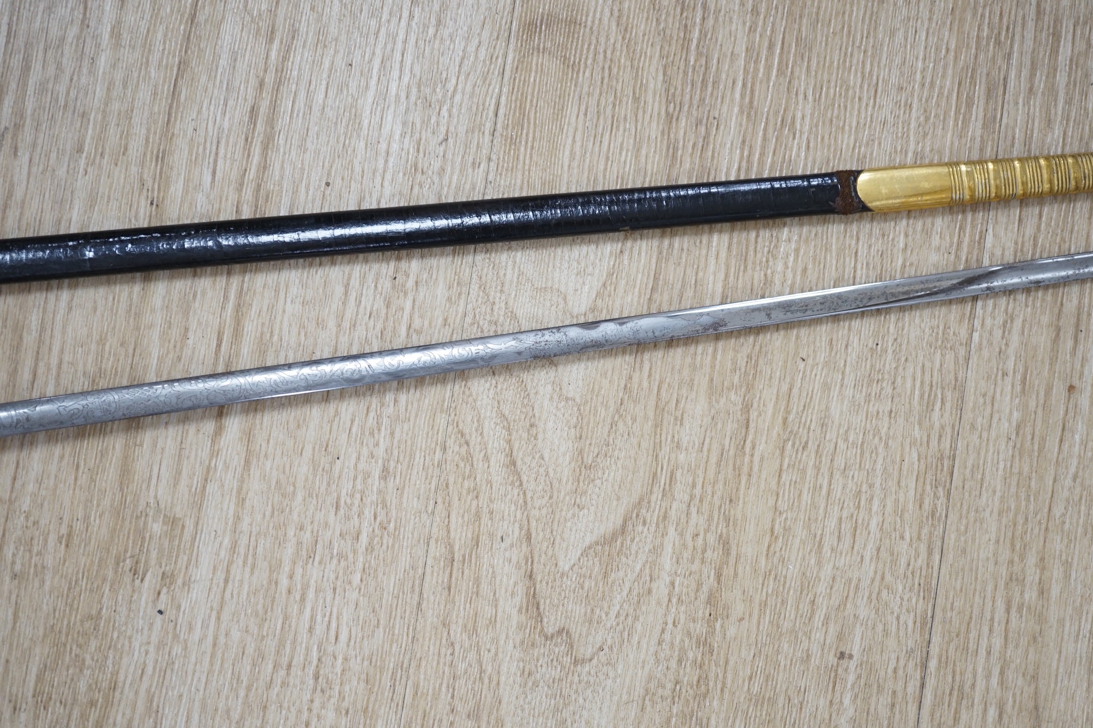 A 19th century officer's dress sword, made by Silver &Co. London with scabbard and leather cover